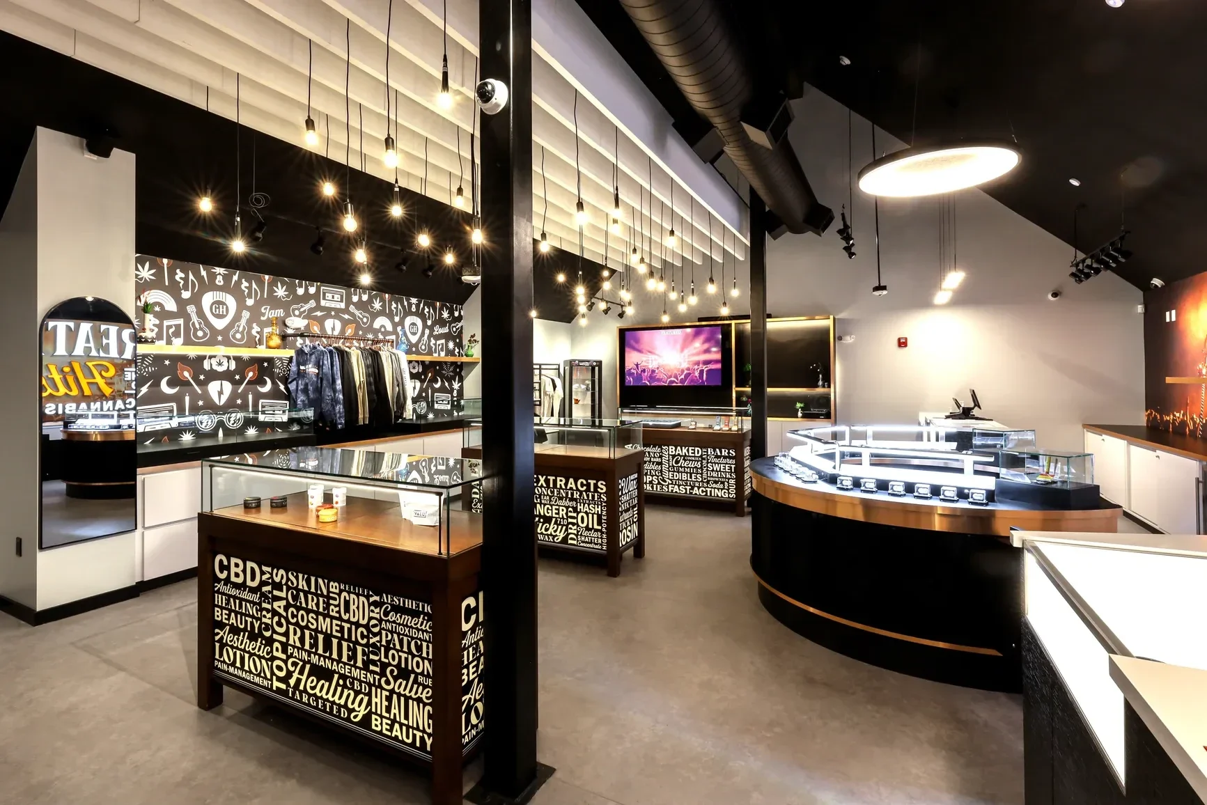 The identity in the built space: category counters, the apparel wall, and the feature screen.