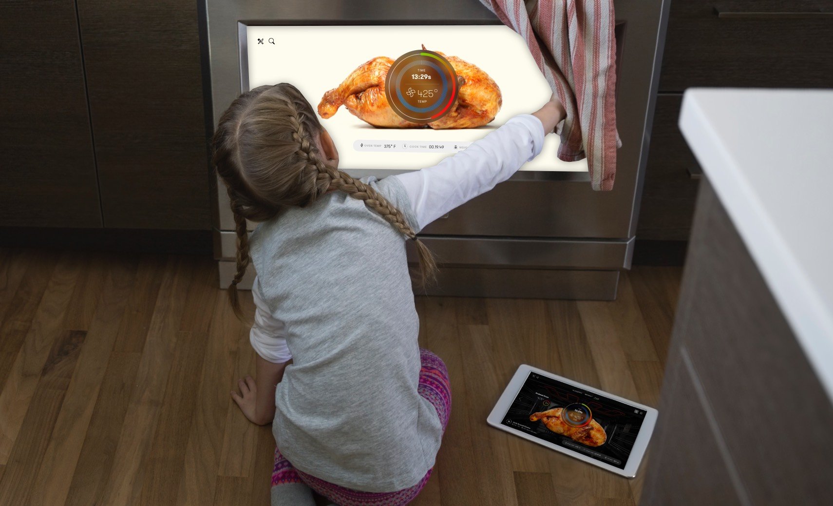 A child opening the oven door, the recipe showing on the screen set into it